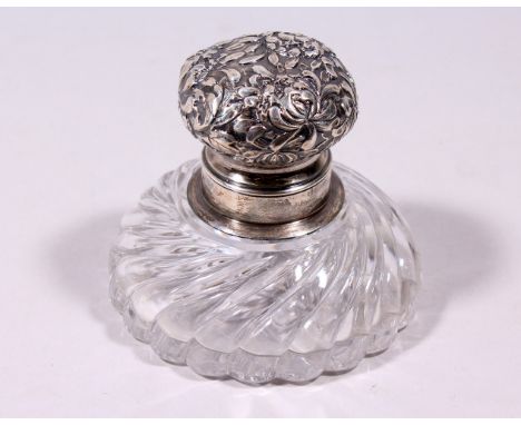 A STERLING SILVER TOP CIRCULAR GLASS INKWELL. 3.5ins diameter.