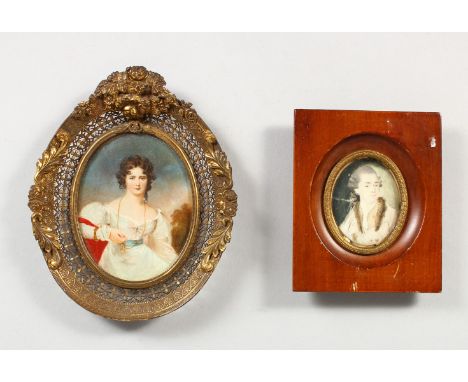 AN OVAL PORTRAIT MINIATURE OF A LADY WEARING A WHITE DRESS, in a pierced metal frame, and another miniature. 5.5ins x 4.5ins 