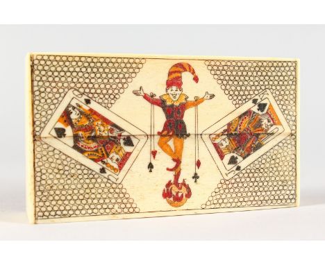 AN ETCHED BONE RECTANGULAR PLAYING CARD BOX, with bone playing cards. 4ins long.