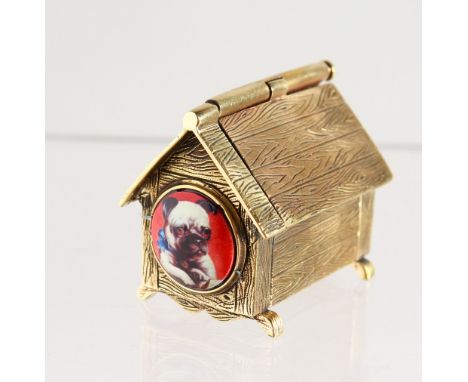 A BRASS NOVELTY DOG KENNEL, with enamel pug dog.