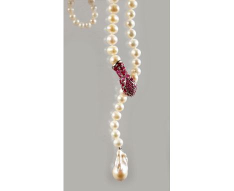 A STRING OF PEARLS with silver and ruby clasp.
