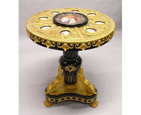 AN IMPRESSIVE EBONISED AND ORMOLU MOUNTED CIRCULAR PEDESTAL TABLE, inset with Sevres style oval portrait panels. 2ft 6ins dia