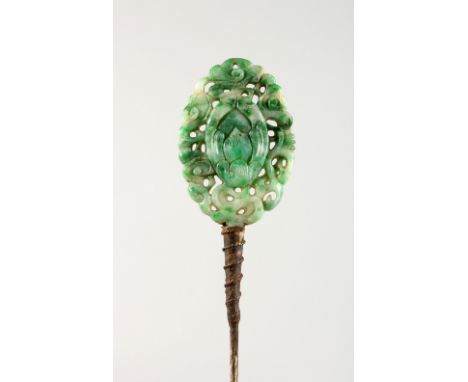 A CHINESE CARVED JADE HAIRPIN. 7ins long.