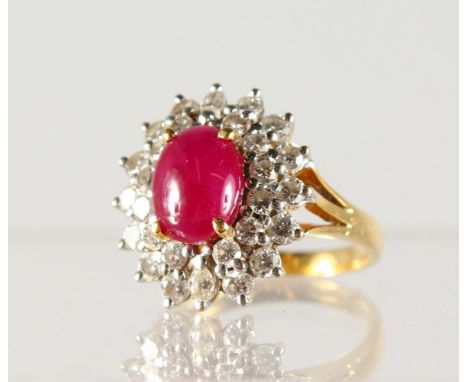 A GOOD RUBY AND DIAMOND OVAL CLUSTER RING, set in yellow gold.