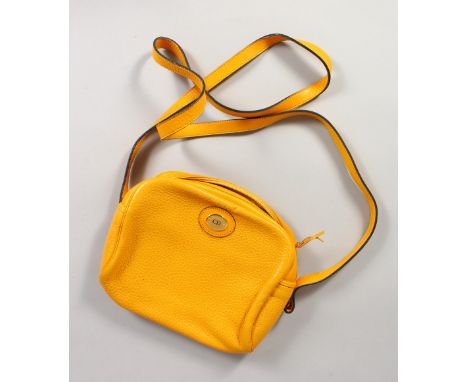 A CHRISTIAN DIOR YELLOW LEATHER SHOULDER BAG AND STRAP, in a Christian Dior bag.