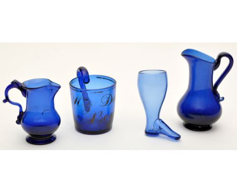 Two blue glass cream jugs and blue glass mug of probably 'North-East' interest, one inscribed "Be Canny **", height 13cms; mu