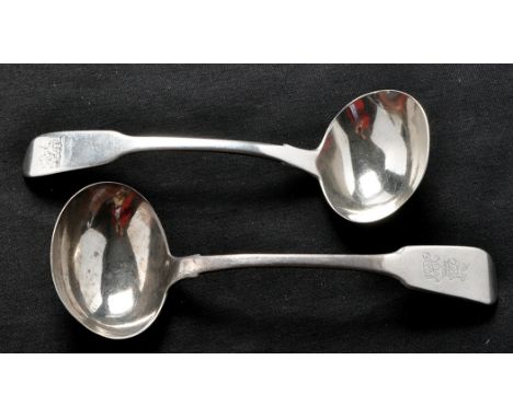 A George IV sauce ladle, by James Brady, Dublin 1825, fiddle pattern, engraved crest and initials; and a George IV sauce ladl