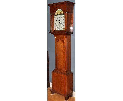 A late Georgian oak longcase clock, the painted roman dial with outer arabic numerals, subsidiary seconds and date dials, fol