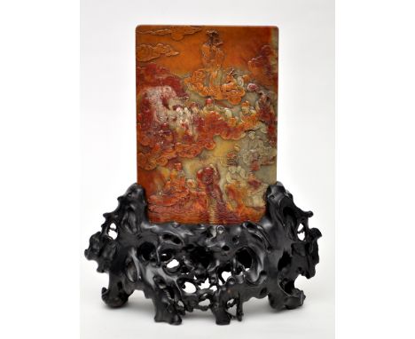 Chinese carved soapstone panel, decorated with figures standing amidst clouds above rockwork and further seated figures, 21 x