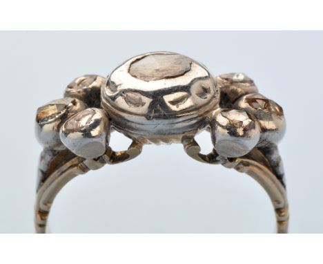 An 18th Century diamond ring, the central rose cut diamond within decorative collet mount, three further rose cut diamonds to