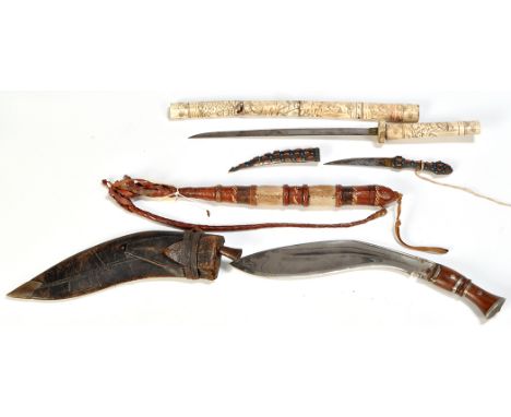 An early 20th Century Japanese tanto, the carved bone hilt and scabbard decorated with figures, 24in. (60cms) long (scabbard 