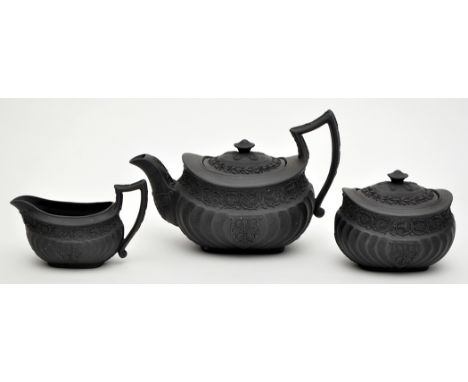 Wedgwood three-piece black basalt bachelor's tea service, with acanthus leaf and guilloche scroll borders, probably second qu