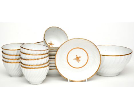 Twenty-one piece part tea service, comprising: ten tea bowls, ten saucers and bowl, spiral fluted bodies with gilt decoration