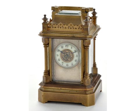 A miniature French brass carriage clock, late 19th/early 20th Century, with enamelled arabic dial, platform lever escapement,