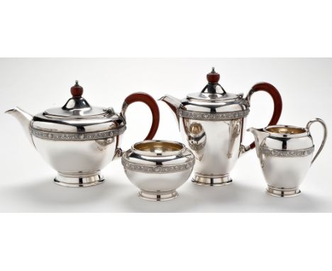 An Elizabeth II four-piece tea service, by Reid & Sons Ltd., London 1973, each piece of circular form with Lindisfarne band, 