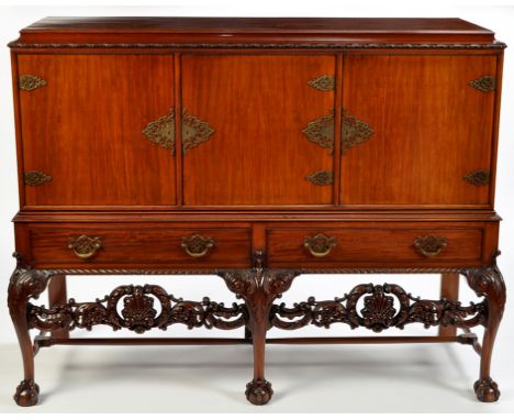An early 20th Century mahogany cabinet, by Robson & Sons Ltd., Newcastle upon Tyne, the caddy top above flowerhead and ribbon