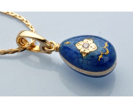 A diamond, enamel and 18ct. yellow gold Faberge egg pattern charm pendant, the brilliant cut diamond weighing 0.02 carats, wi