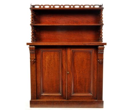 A Victorian mahogany chiffonier, the open double shelf back with pierced gallery and sides, spiral twist supports above a pai