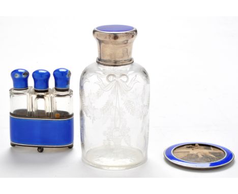 A George V engraved glass bottle with silver and blue cover, by Wright & Davies (William Frederick Wright), London 1916, circ