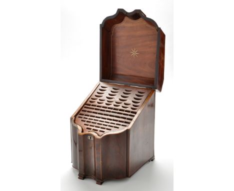 A large George III mahogany serpentine front knife box, the sloping cover opening to reveal a fitted interior with inlaid ebo