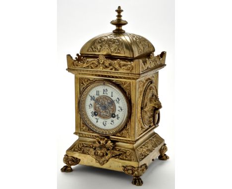 A late 19th Century French brass mantel clock, with Gothic style enamel dial, the twin train movement striking on a gong, the