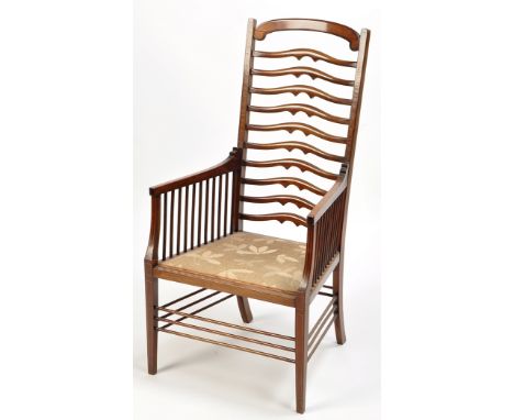 An Edwardian mahogany ladder back armchair with satinwood crossbanding, the curved cresting rail above multiple shaped mid ra
