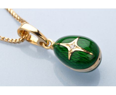 A diamond, enamel and 18ct. yellow gold Faberge egg pattern charm pendant, the brilliant cut diamond weighing 0.015 carats wi