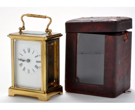 A brass carriage clock, late 19th/early 20th Century, with enamelled roman dial, platform lever escapement, bevelled glass pa