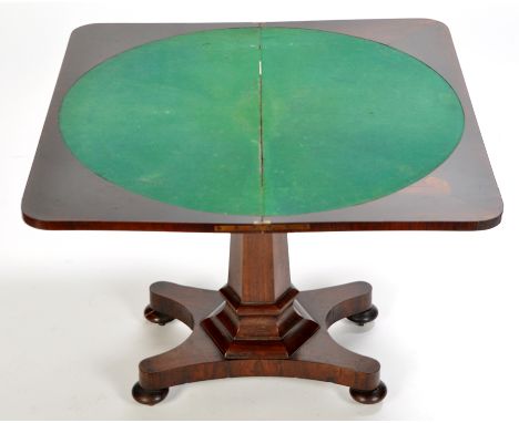 An early 19th Century rosewood turnover swivel top card table, the rounded rectangular top opening to reveal circular baize l