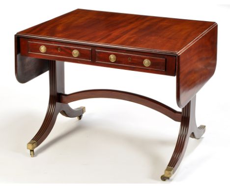 A Georgian style mahogany sofa table, the rectangular top and fall flaps with moulded edge above two frieze drawers, one stam