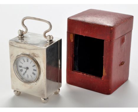 A late Victorian silver-cased small carriage clock, probably by Lawrence Emanuel, Birmingham 1896, enamelled roman dial, Fren