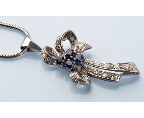 A sapphire and diamond drop pendant of bow form, centred by four circular facet cut sapphires surrounded by eight-cut diamond