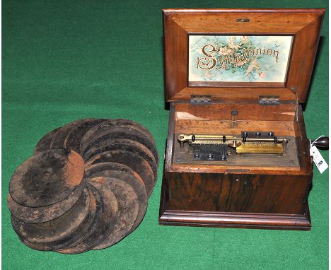 A 19th Century walnut cased German symphonium, by Schutz-Marke, playing 8 1/4in. (21cms) discs, on two 3 1/4in. (8cms) steel 