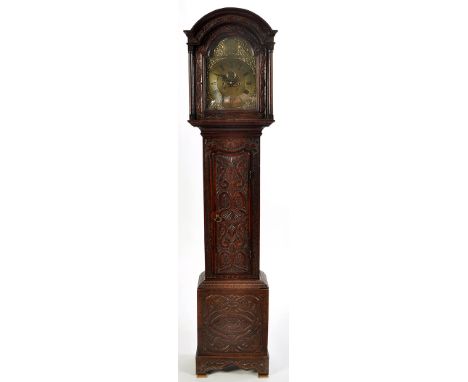 Hugh Lough, Penrith: a carved oak longcase clock, with brass roman dial and moon phase, dummy winding holes, vacant date aper