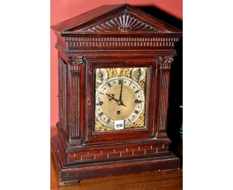 A late 19th Century oak bracket clock, the brass dial with silvered roman chapter ring and subsidiary slow/fast and chime/sil