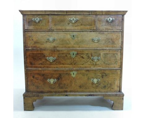 An 18th century walnut, crossbanded and featherbanded chest, containing an arrangement of six drawers, on bracket feet, 99cm