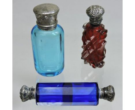 A Victorian blue glass double ended scent bottle, of faceted shape, with silver plated covers, 10cm long, together with a cut