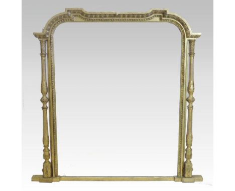 A Victorian carved pine and gilt gesso framed over mantle mirror, the arched plate, within a moulded surround with egg and da