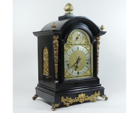 An 19th century ebonised bracket clock, with gilt metal mounts, the arched case having pierced grille sides and surmounted by