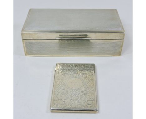 An early 20th century silver table cigarette box, with engine turned decoration, Birmingham, 1927, 18cm, together with a Vict