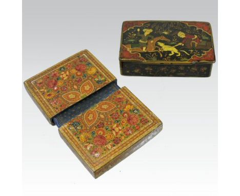 A 19th century Persian painted papier mache visiting card case, finely decorated with flowers, 10cm tall, together with an In