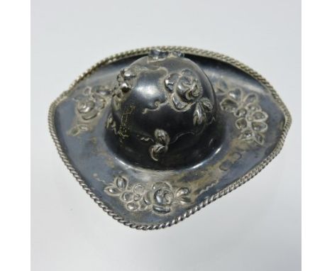 A Victorian silver snuff box, in the form of a wide brimmed hat, with a hinged cover, relief decorated with a figure and scro