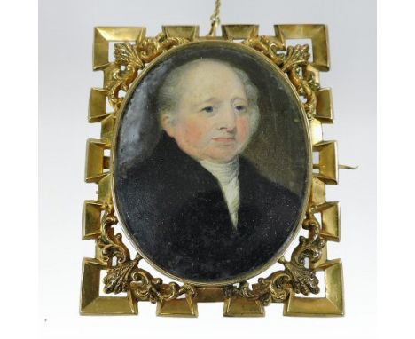 English School, 19th century, a portrait miniature of a gentleman, wearing a black coat, oil, in an ornate unmarked openwork 