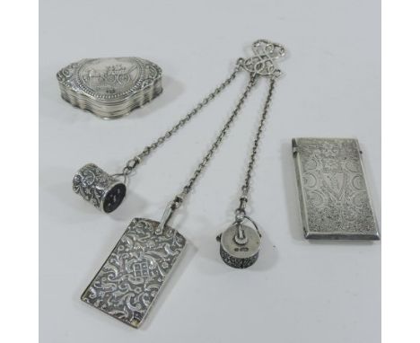 An Edwardian silver chatelaine, suspended with a pin cushion, a tape and a sliding ivory and silver note pad, Birmingham 1901