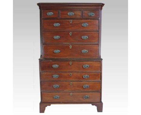 A George III mahogany chest on chest, the upper section containing three short over three long graduated drawers, between can