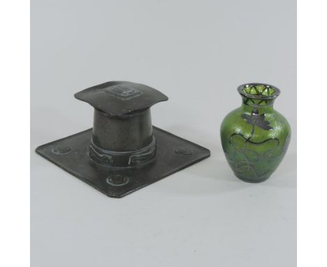 An Art Nouveau pewter inkwell, designed by Archibald Knox for Liberty circa 1901, of rectangular shape, with a hinged lid and