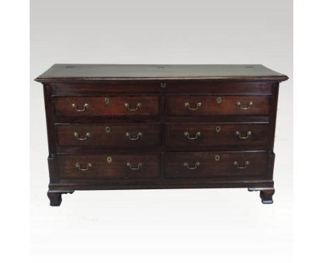 An 18th century oak and mahogany crossbanded Lancashire mule chest, with a hinged lid, containing a pair of dummy drawers, ov