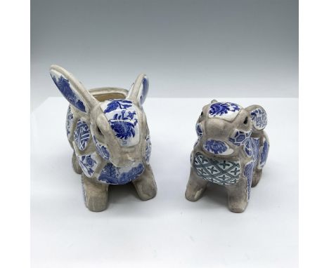 Unique mosaic floral tile design in blue and white on figures. Large figure measures 6.25"L x 3"W x 4.5"H and small rabbit wi