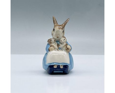 Glossy porcelain. Features a Rabbit holding two smaller rabbits. Royal Albert Beatrix Potter backstamp. This item has its ori