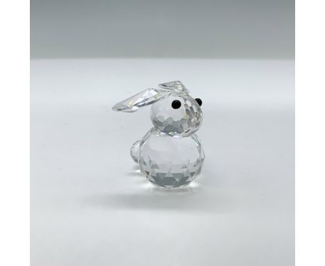 Charming little bunny with long ears lying flat in the head. The eyes are in black crystal. This item has its original box. B